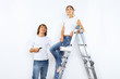 Young couple with paint brushes together