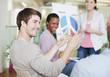 Photo: Business people discussing pie chart in meeting Business people discussing pie chart in meeting