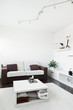 Modern living room with sofa and white table