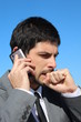 Businessman is speaking on his smartphone, worried