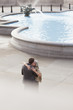 Couple hugging near fountain