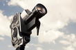Photos : vintage 8mm camera with a cloudy background