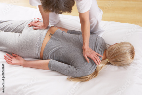 Photo: Woman having Shiatsu massage Woman having Shiatsu massage