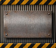 Grunge metal plate with black and yellow stripes