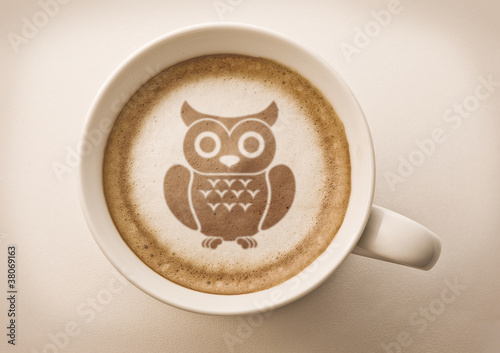 Photo: owl drawing latte art on coffee cup owl drawing latte art on coffee cup