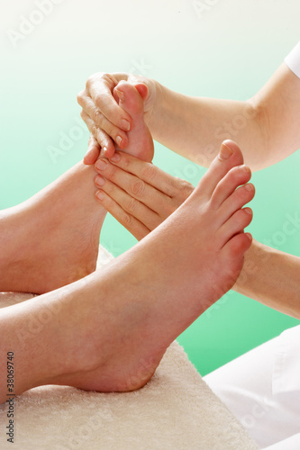 Photo: Detail woman having foot massage Detail woman having foot massage