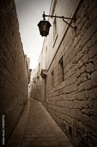 Photo: Retro photo of narrow town street Retro photo of narrow town street