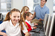 Girl in school class smiling to camera