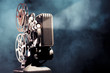 Photo: old film projector with dramatic lighting old film projector with dramatic lighting