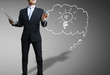 Business man hand drawing light bulb