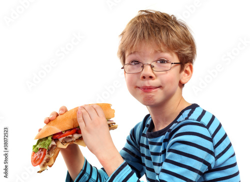 Photo: boy eating large sandwich boy eating large sandwich
