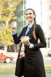 smiling businesswoman with breakfast