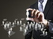 Photo: Businessman hand touching Social network icon Businessman hand touching Social network icon