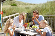 Photo: Family on vacation eating outdoors Family on vacation eating outdoors