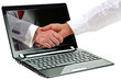 Foto: Laptop with business agreement symbol on display Laptop with business agreement symbol on display