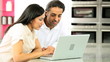Attractive Asian Couple in Kitchen with Laptop