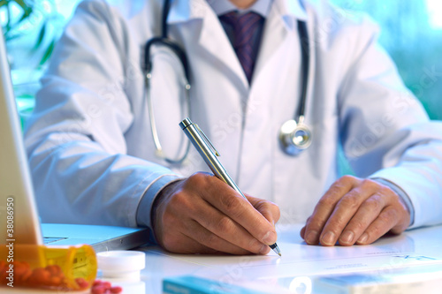 Photo: Doctor writing prescription Doctor writing prescription