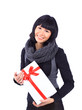 Beautiful business woman holding a gift isolated on white Beautiful business woman holding a gift isolated on white