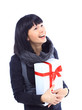 Beautiful business woman holding a gift isolated Beautiful business woman holding a gift isolated