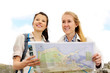 Two young women discussing the direction to take