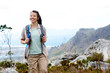 Happy young woman trekking in nature
