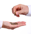 Cropped view of male hand giving euro coins to another person