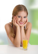 beautiful happy cheerful girl with orange juice
