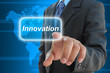 businessman hand pushing innovation button businessman hand pushing innovation button