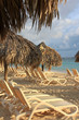 Beach huts and lounge chairs in sunrise light Beach huts and lounge chairs in sunrise light