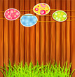 Easter eggs on a wooden wall background Easter eggs on a wooden wall background