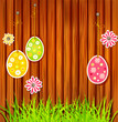Easter eggs on a wooden wall background Easter eggs on a wooden wall background