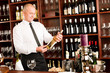 Wine bar waiter happy male in restaurant