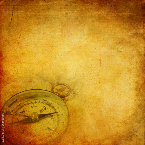 Photo: Aged paper with compass Aged paper with compass