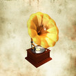 Retro gold gramophone over grunge background
