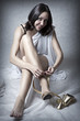 Young sexy woman wearing gold shoes