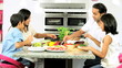 Young Asian Family Making Healthy Lunch Together