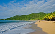 canvas print picture - At a beach of the Caribbean Sea with waves
