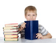 The boy reads the book isolated on white