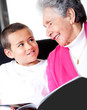 Grandmother reading to grandson
