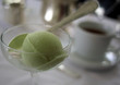 Green tea sorbet and coffee in the background Green tea sorbet and coffee in the background