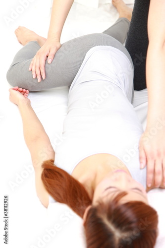 Photo: young Japanese woman getting a chiropractic young Japanese woman getting a chiropractic