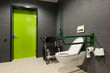 Photo: a toilet for disabled people with green bars, wheelchair a toilet for disabled people with green bars, wheelchair