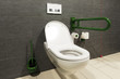 Photo: extreme wide angle of a white toilet for disabled persons extreme wide angle of a white toilet for disabled persons