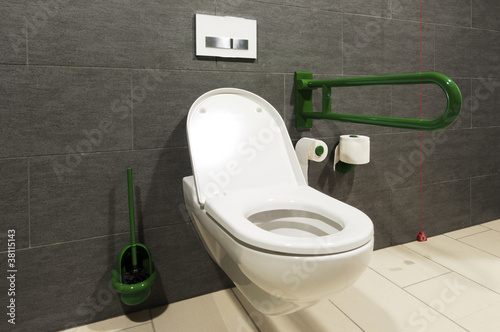Photo: extreme wide angle of a white toilet for disabled persons extreme wide angle of a white toilet for disabled persons