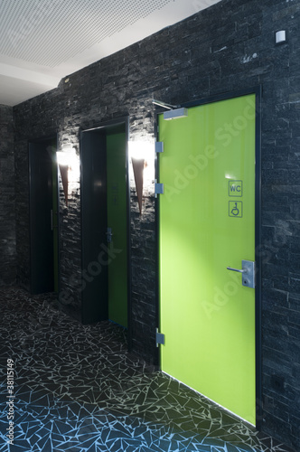 Photo: toilet door made of plexi glass in a swimming pool toilet door made of plexi glass in a swimming pool