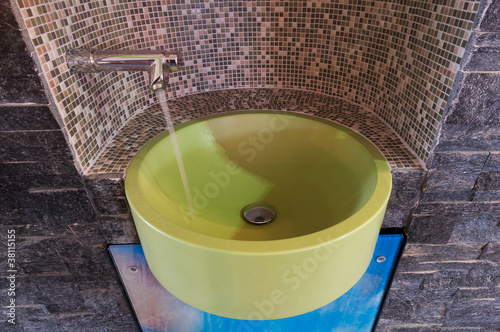 Photo: green washbowl with water tap niched with mosaic tiles green washbowl with water tap niched with mosaic tiles