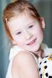 portrait of a beautiful little girl with a toy dog