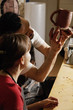Photo: Pottery teacher showing student the jug Pottery teacher showing student the jug