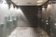 Photo: several showers seperated with walls of glass several showers seperated with walls of glass
