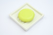 Green Soap in soap-dish on blue